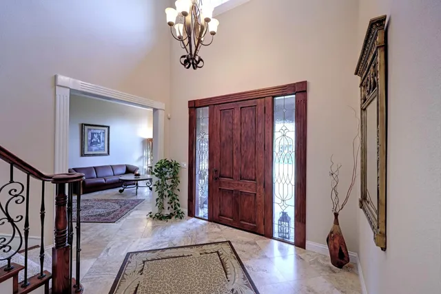 a view of a livingroom with furniture and hallway