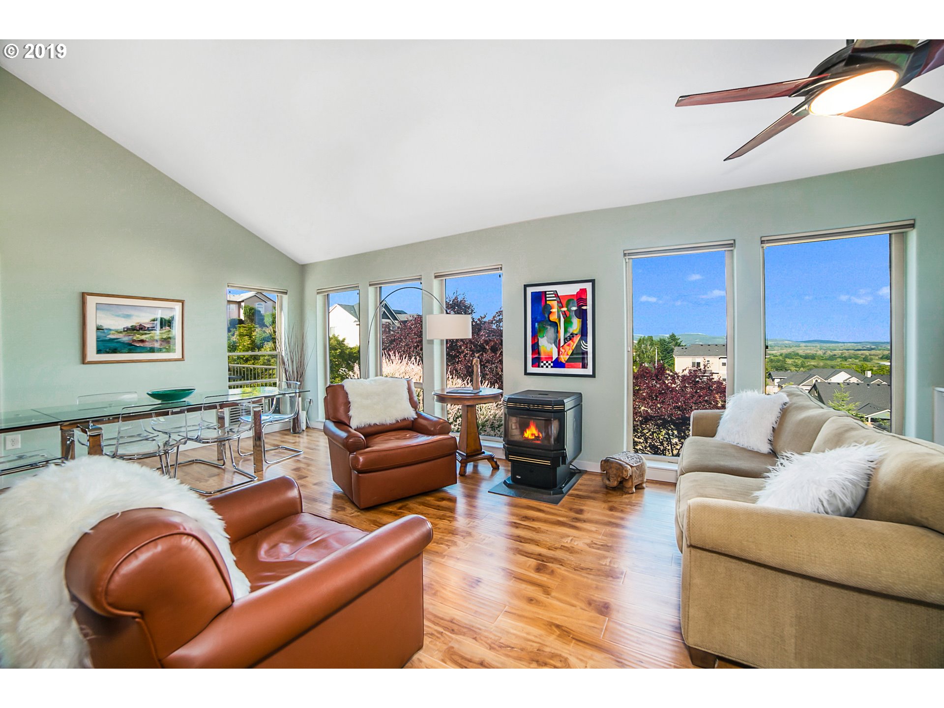 1119 Southwest 1st Street Dundee, OR 97115 - Photo 12 of 32 a living room with furniture a flat screen tv and a fireplace