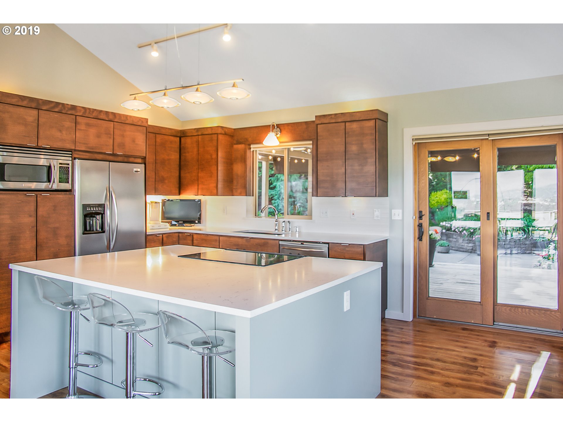 1119 Southwest 1st Street Dundee, OR 97115 - Photo 13 of 32 a kitchen with stainless steel appliances granite countertop a sink a refrigerator and a stove