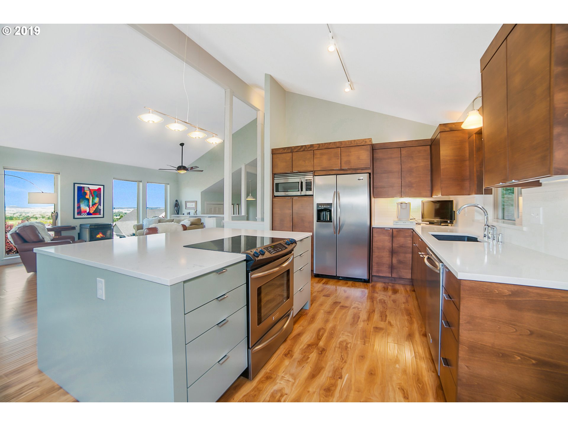 1119 Southwest 1st Street Dundee, OR 97115 - Photo 14 of 32 a kitchen with stainless steel appliances granite countertop a sink a stove and a wooden floors