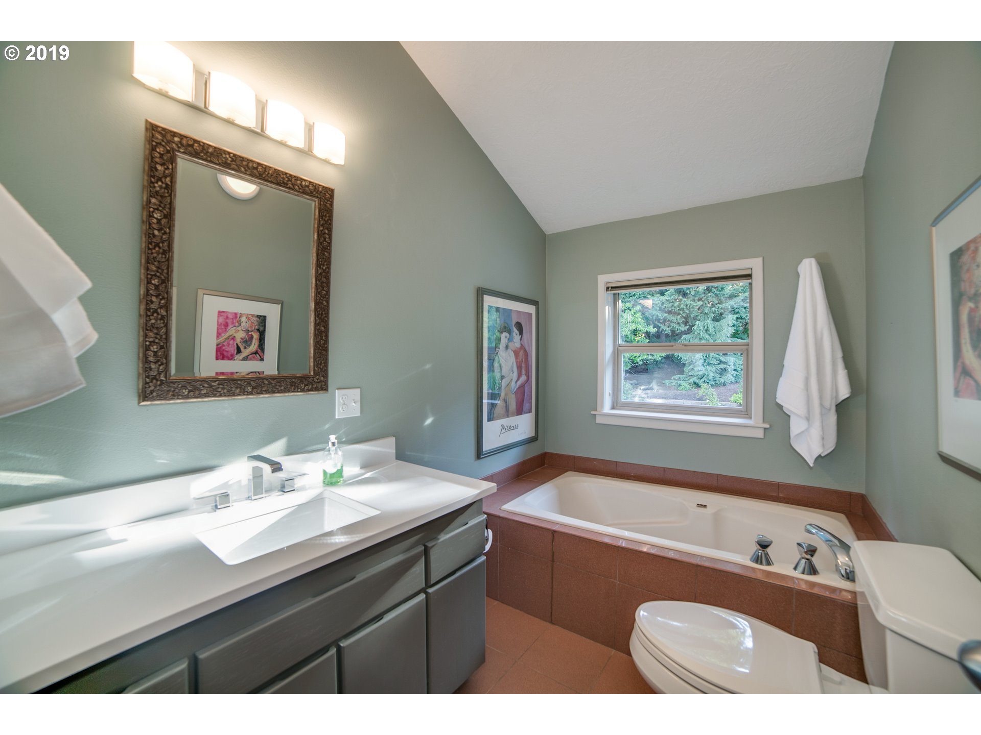 1119 Southwest 1st Street Dundee, OR 97115 - Photo 22 of 32 a bathroom with a tub sink and mirror