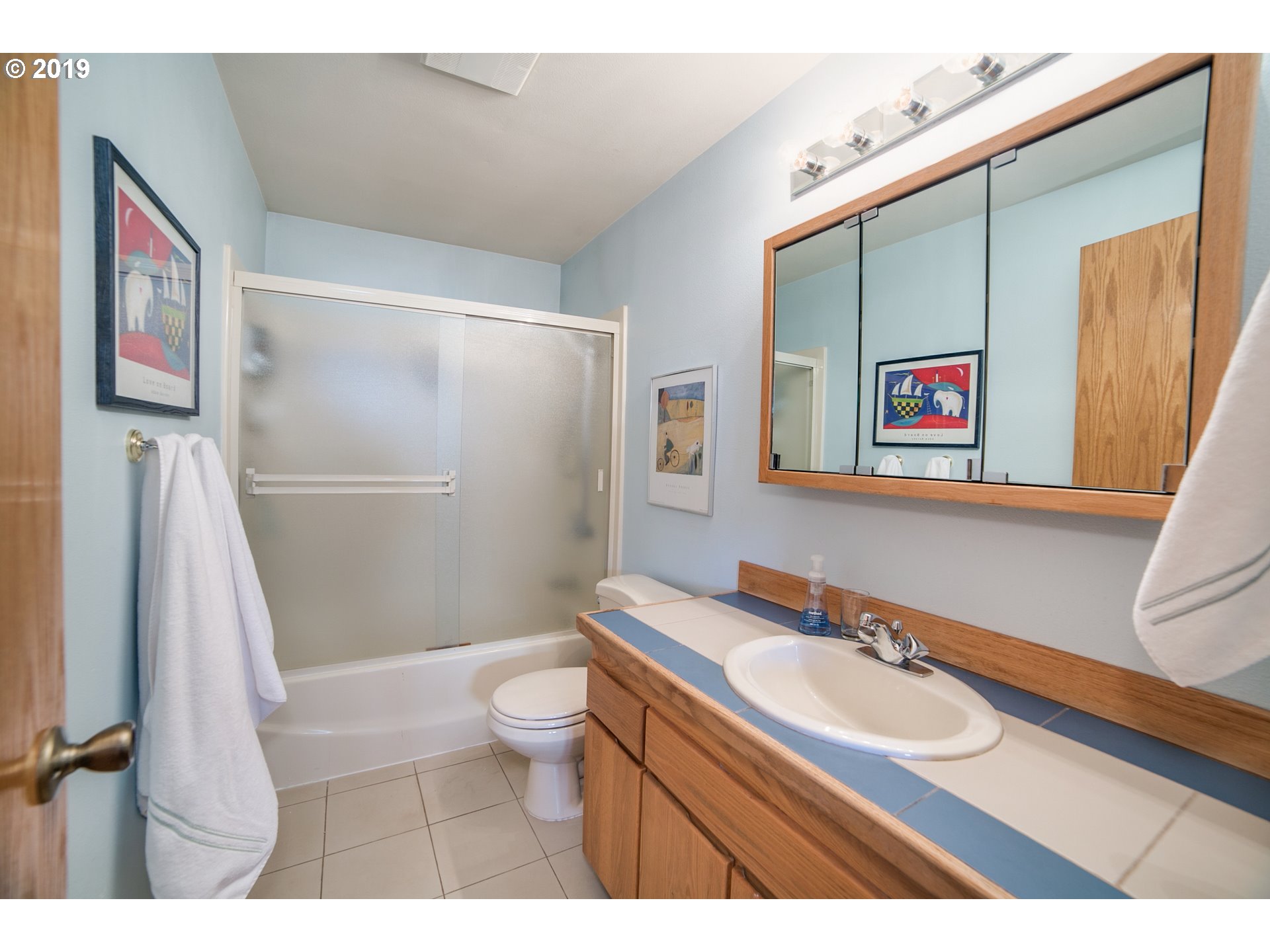 1119 Southwest 1st Street Dundee, OR 97115 - Photo 23 of 32 a bathroom with a sink and a mirror