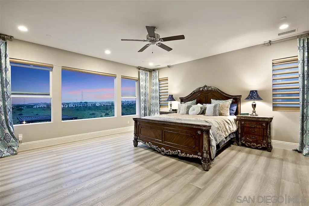 16438 Nicole Ridge Road San Diego, CA 92127 - Photo 12 of 25 a bedroom with a bed and large window