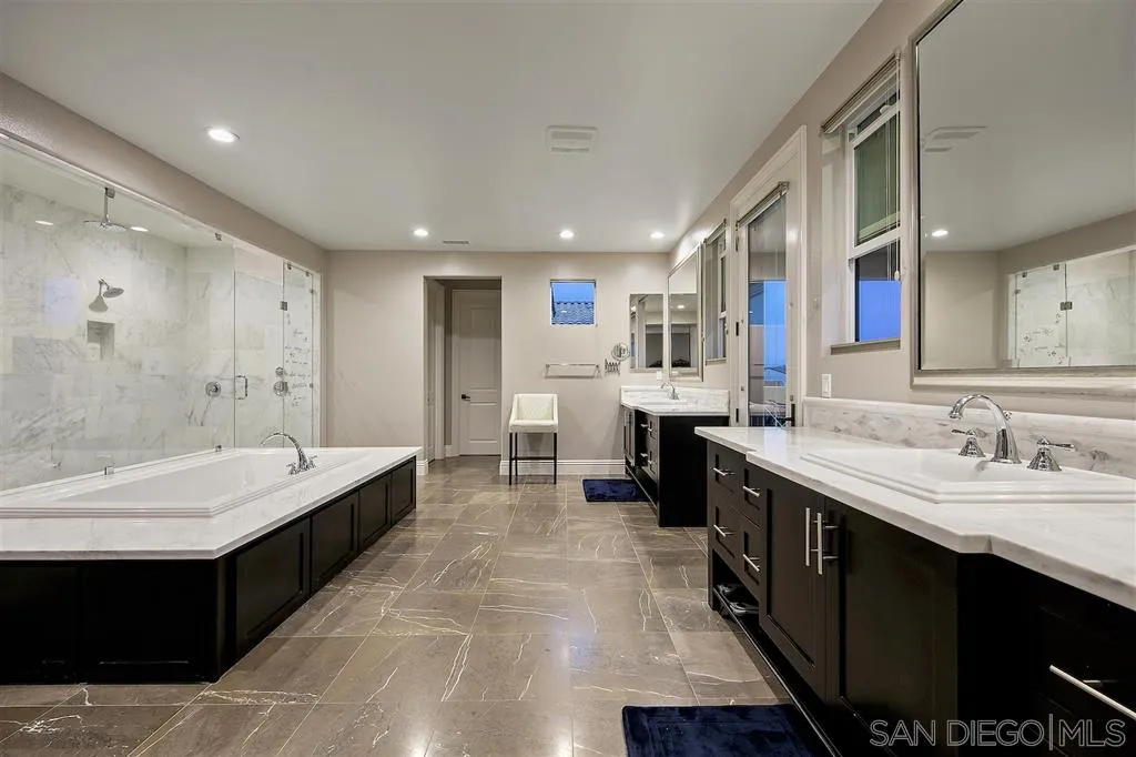 16438 Nicole Ridge Road San Diego, CA 92127 - Photo 14 of 25 a large bathroom with a double vanity sink mirror and double