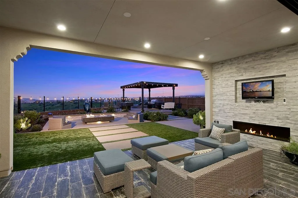 16438 Nicole Ridge Road San Diego, CA 92127 - Photo 16 of 25 a view of a patio with couches chairs and a fire pit