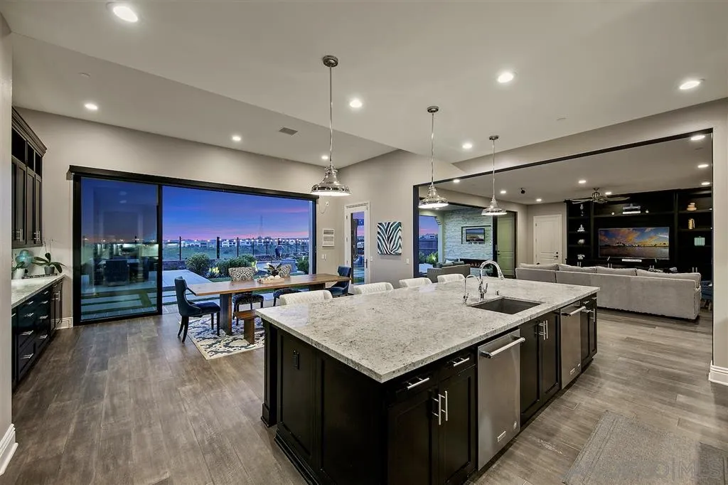 16438 Nicole Ridge Road San Diego, CA 92127 - Photo 6 of 25 a kitchen with a stove and a refrigerator
