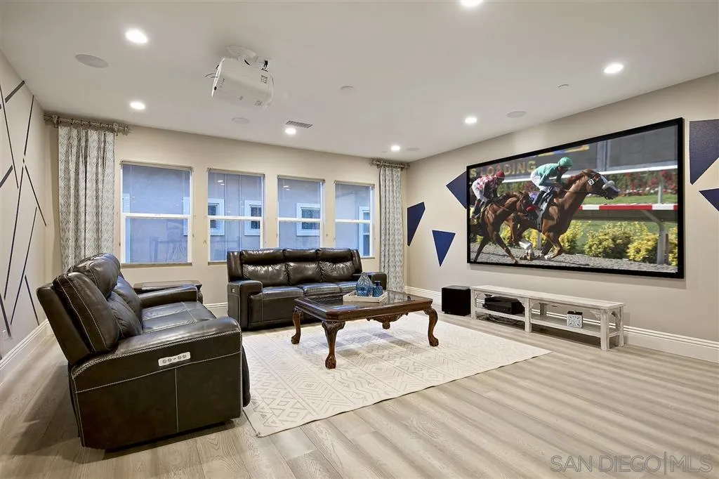 16438 Nicole Ridge Road San Diego, CA 92127 - Photo 10 of 25 a living room with furniture and a flat screen tv