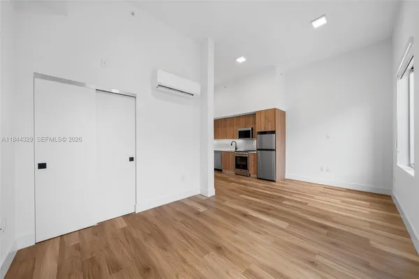 a view of a kitchen with wooden floor