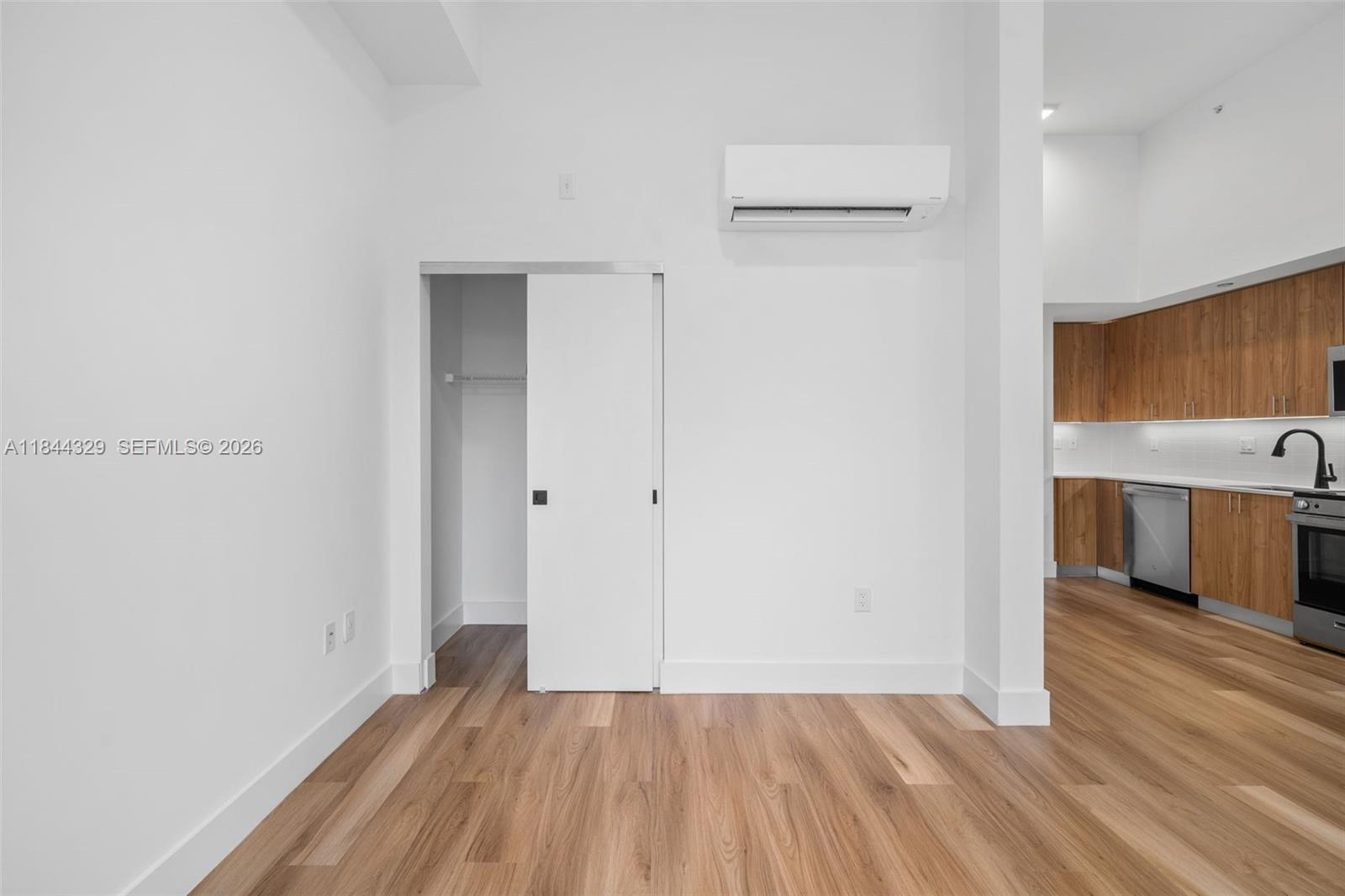 650 Southwest 1st Street, Unit 103 Miami, FL 33130 - Photo 8 of 22 a view of a room with wooden floor