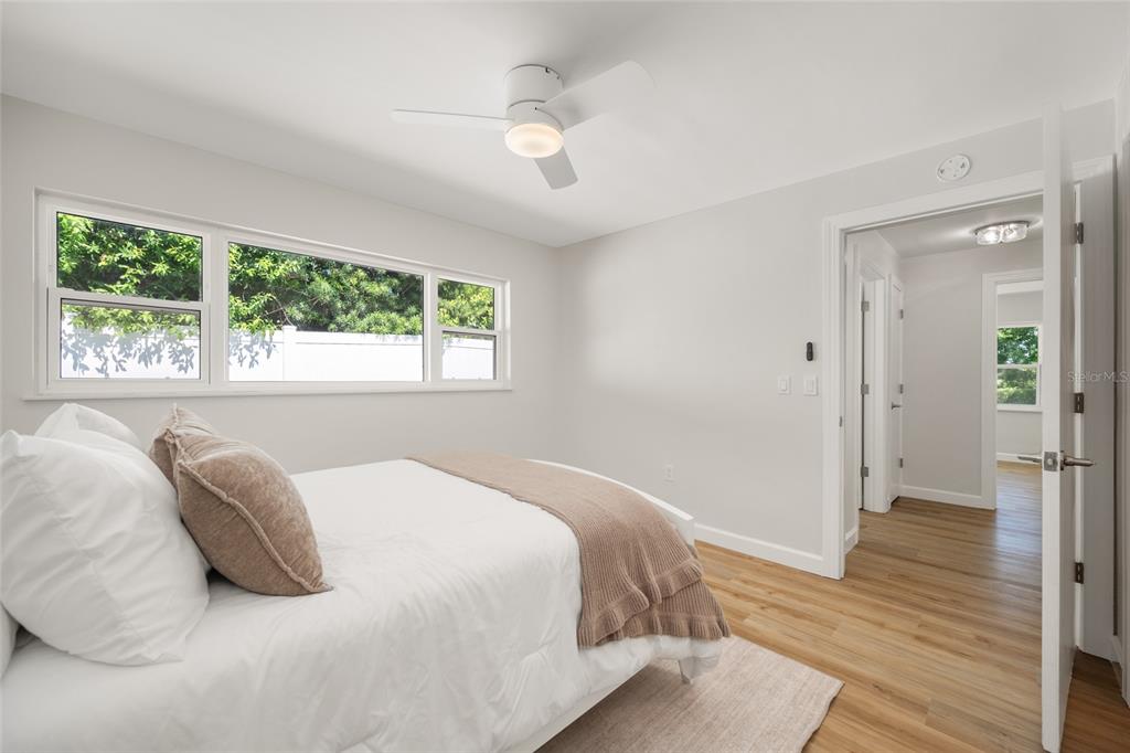 656 Mehlenbacher Road Belleair, FL 33756 - Photo 29 of 49 a bedroom with a bed and a large window with outer view