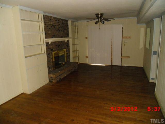 5005 Oak Park Road Raleigh, NC 27612 - Photo 7 of 9 wooden floor in an empty room