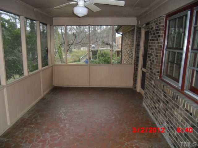 5005 Oak Park Road Raleigh, NC 27612 - Photo 9 of 9 wooden floor in an empty room with a window