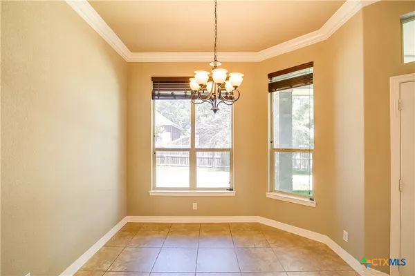 a kitchen with stainless steel appliances granite countertop a refrigerator a oven and a sink with granite countertops