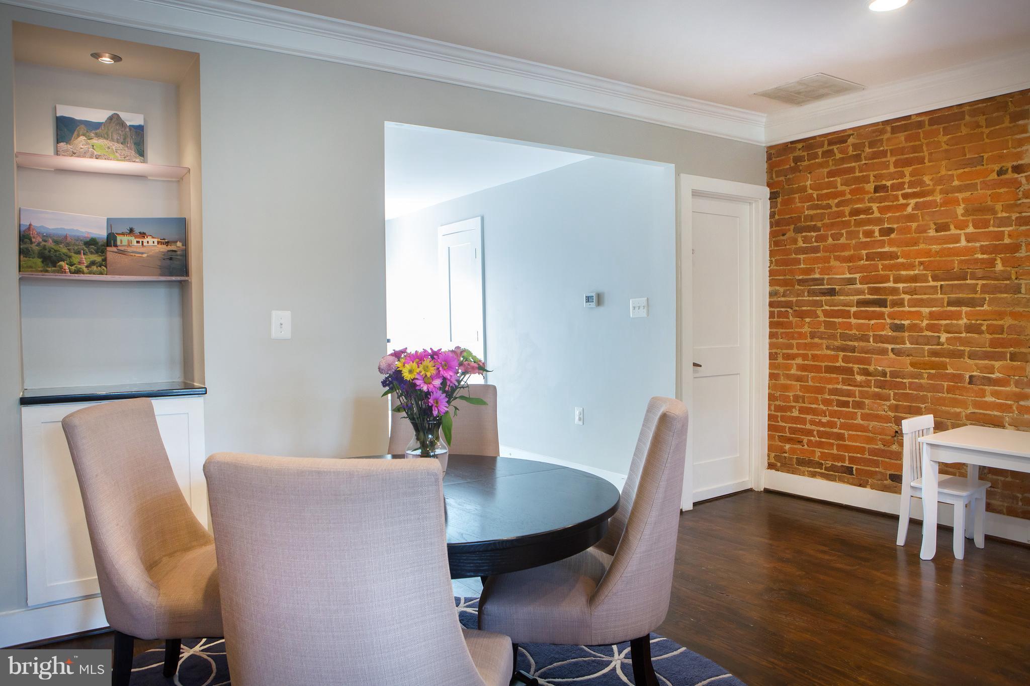 307 E Street Northeast Washington, DC 20002 - Photo 11 of 29 Dining Room with Serving Cabinet, Exposed Brick