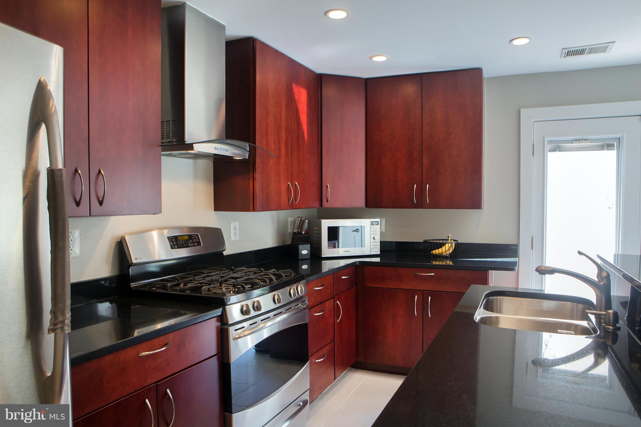307 E Street Northeast Washington, DC 20002 - Photo 15 of 29 Gourmet Kitchen with Stone and Steel!