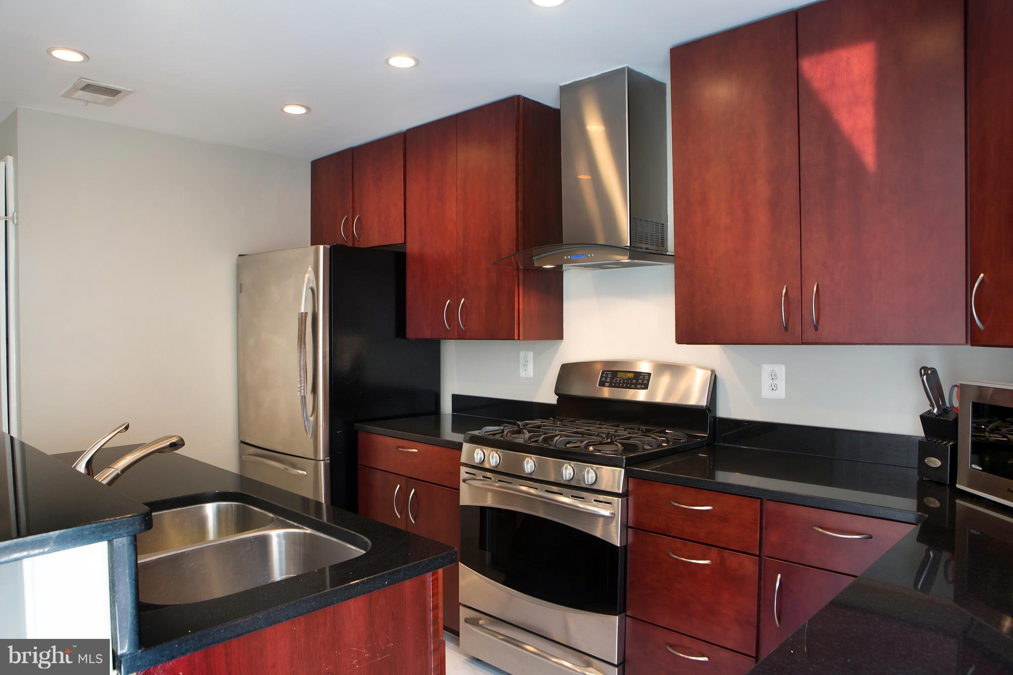 307 E Street Northeast Washington, DC 20002 - Photo 16 of 29 Kitchen with Stainless Steel and Granite