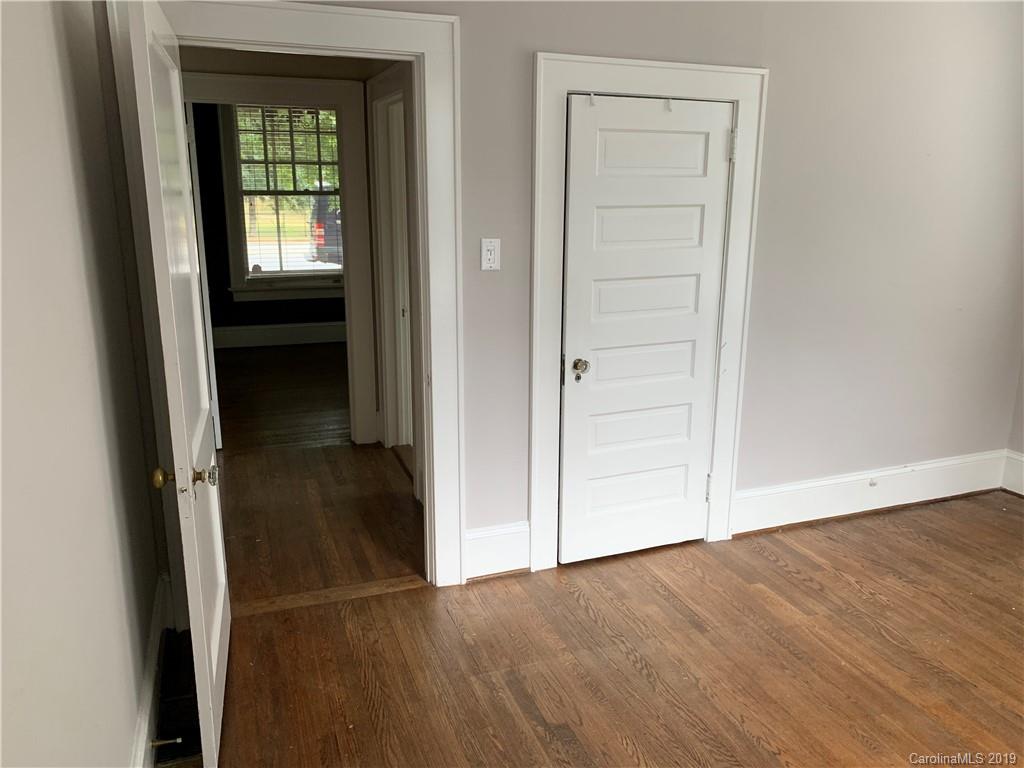 224 Providence Road Charlotte, NC 28207 - Photo 13 of 27 a view of an empty room with closet and a window