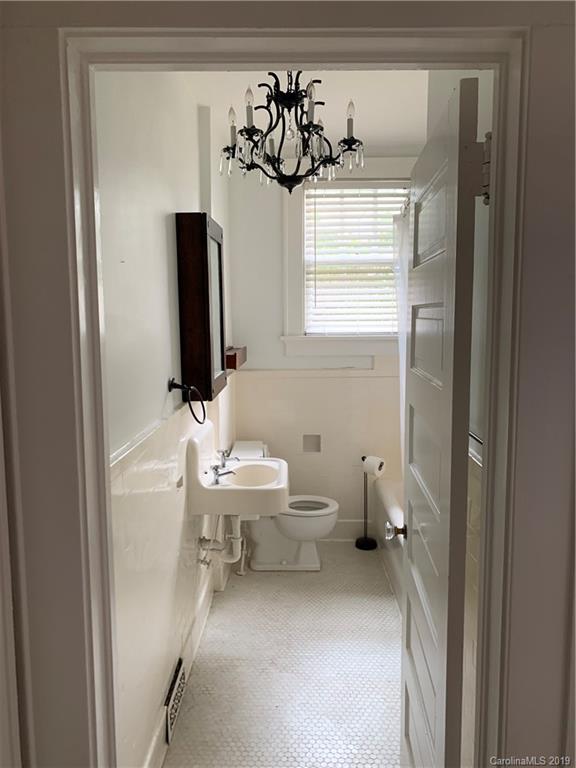 224 Providence Road Charlotte, NC 28207 - Photo 17 of 27 a bathroom with a sink and a mirror