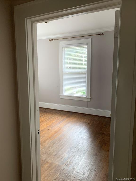 224 Providence Road Charlotte, NC 28207 - Photo 18 of 27 a view of a room with wooden floor and window