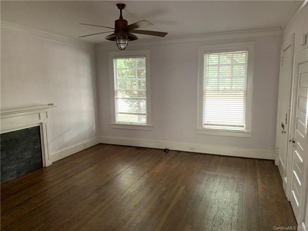 224 Providence Road Charlotte, NC 28207 - Photo 20 of 27 a view of an empty room with wooden floor and a window