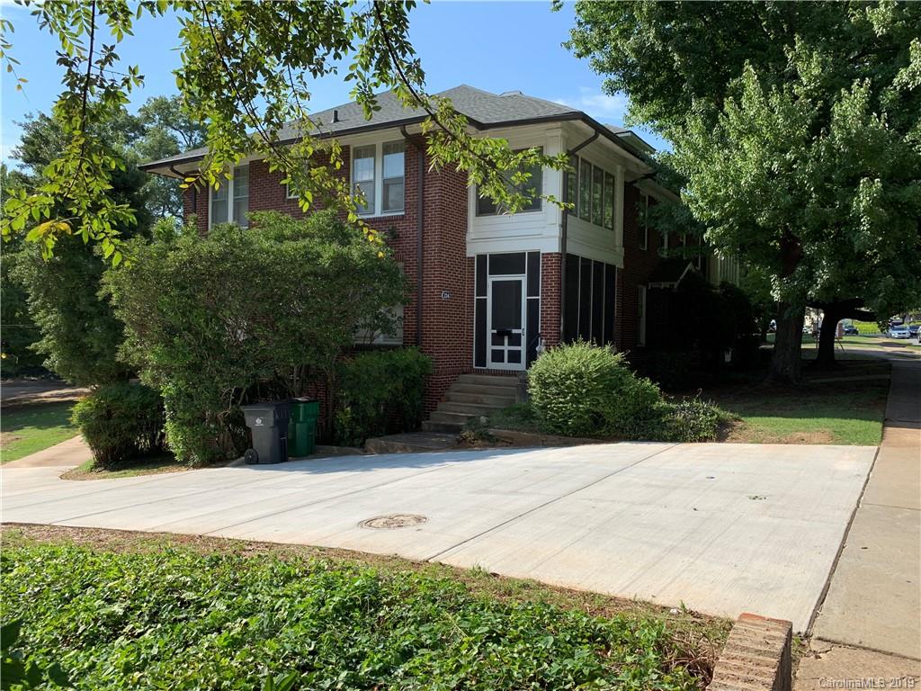 224 Providence Road Charlotte, NC 28207 - Photo 3 of 27 a view of backyard with potted plants and a large tree