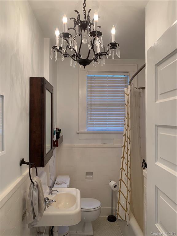 224 Providence Road Charlotte, NC 28207 - Photo 8 of 27 a bathroom with a toilet sink and mirror