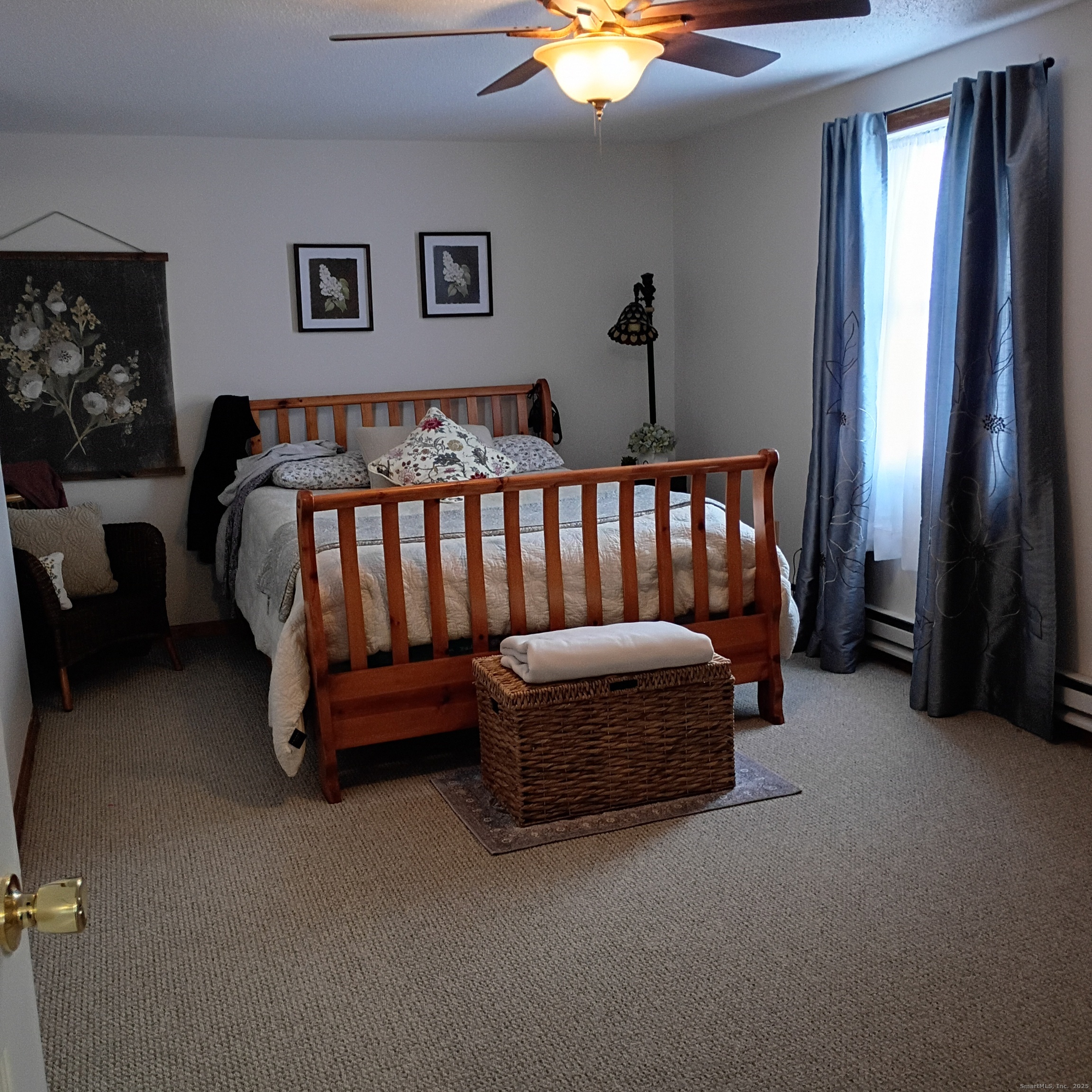 59 View Street, Unit 2 Bristol, CT 06010 - Photo 16 of 37 a bed sitting in a bedroom next to a window