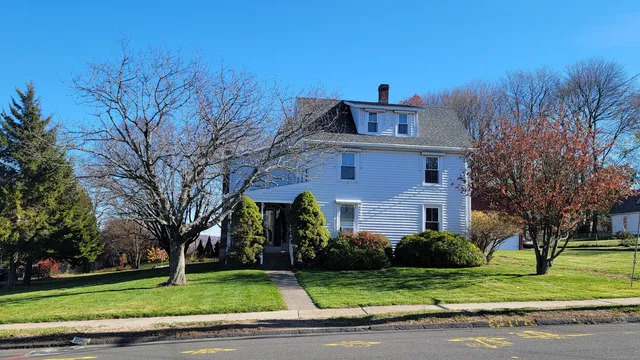 a front view of a house with a yard