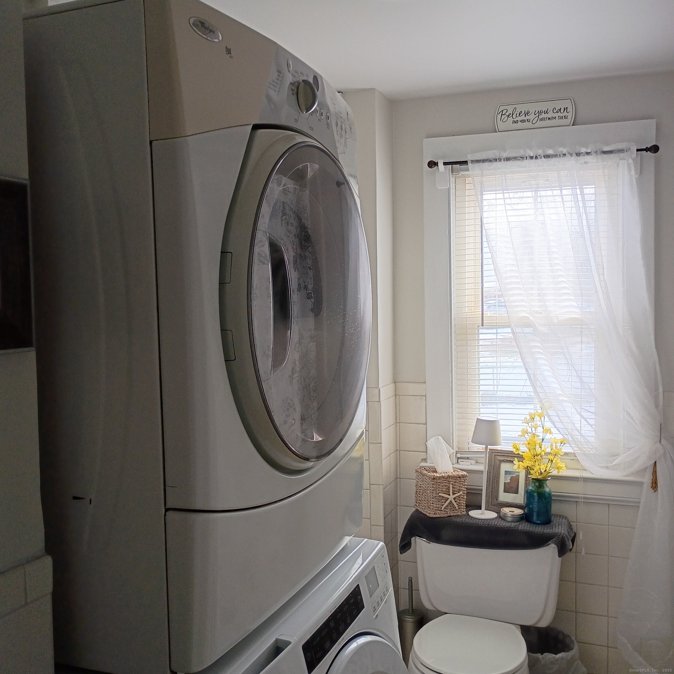 59 View Street, Unit 2 Bristol, CT 06010 - Photo 30 of 37 a bathroom with a toilet mirror vanity and window