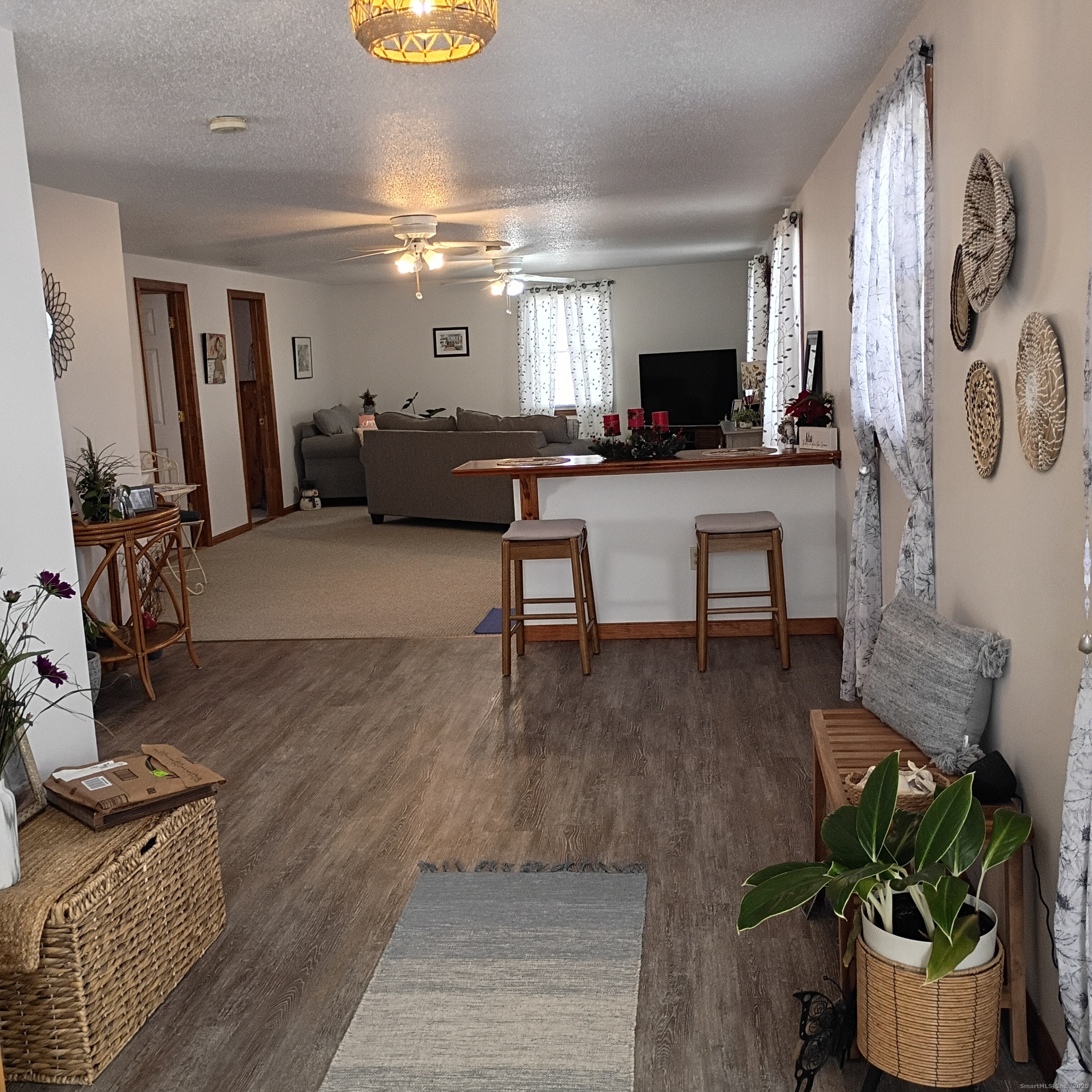 59 View Street, Unit 2 Bristol, CT 06010 - Photo 3 of 37 a living room with furniture and a flat screen tv