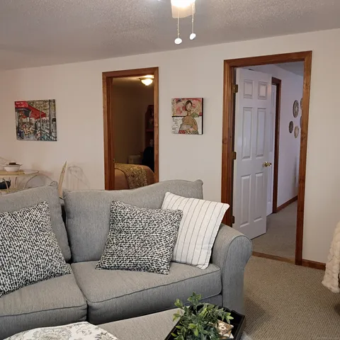 a living room with furniture and a window