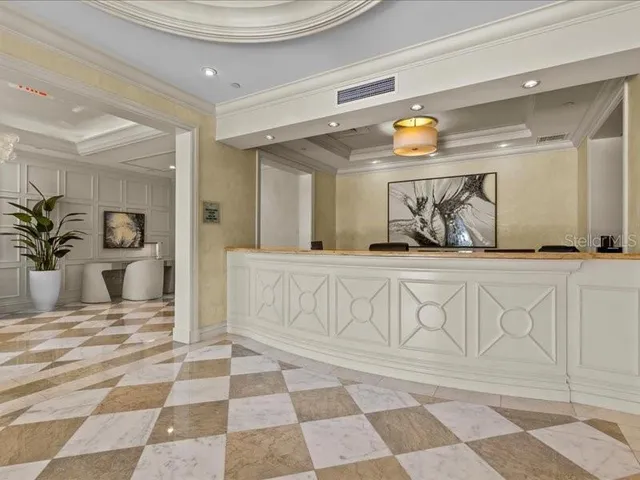 a large kitchen with stainless steel appliances granite countertop a sink and cabinets