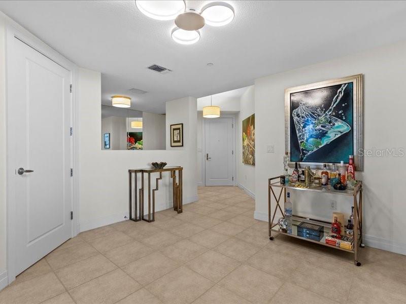 331 Cleveland Street, Unit 806 Clearwater, FL 33755 - Photo 21 of 83 a bedroom with furniture and a chandelier