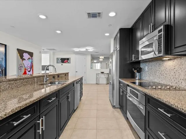 a bathroom with a double vanity sink and a bathtub