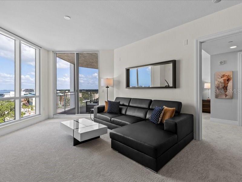 331 Cleveland Street, Unit 806 Clearwater, FL 33755 - Photo 31 of 83 a living room with furniture and a large window