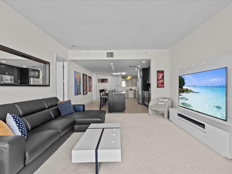 331 Cleveland Street, Unit 806 Clearwater, FL 33755 - Photo 34 of 83 a living room with furniture and a flat screen tv