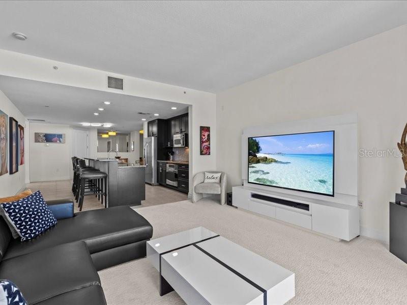 331 Cleveland Street, Unit 806 Clearwater, FL 33755 - Photo 39 of 83 a living room with furniture and a flat screen tv