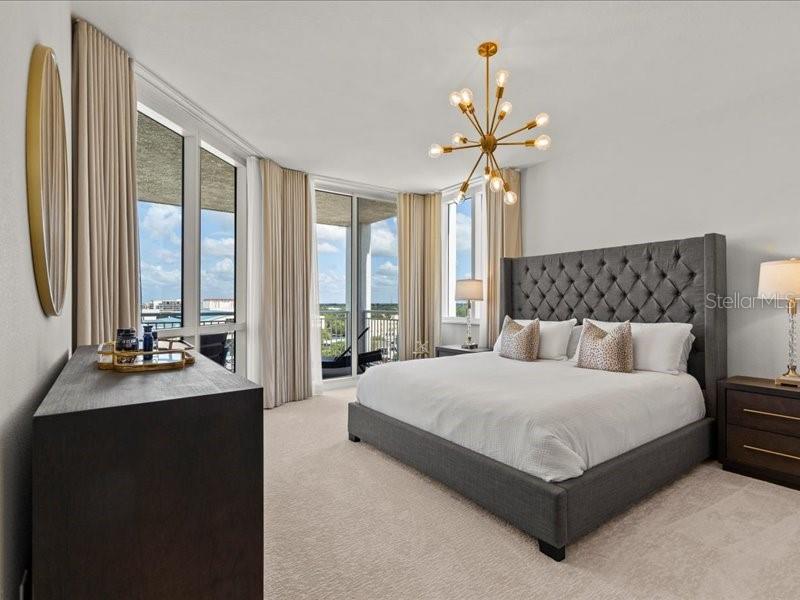 331 Cleveland Street, Unit 806 Clearwater, FL 33755 - Photo 40 of 83 a bedroom with a large bed and a large window