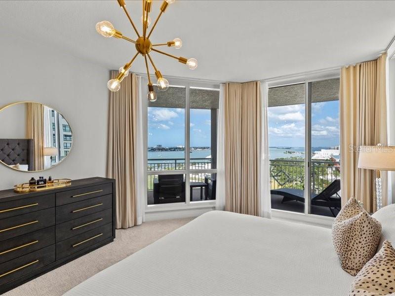 331 Cleveland Street, Unit 806 Clearwater, FL 33755 - Photo 4 of 83 a bedroom with a bed dresser and a large window