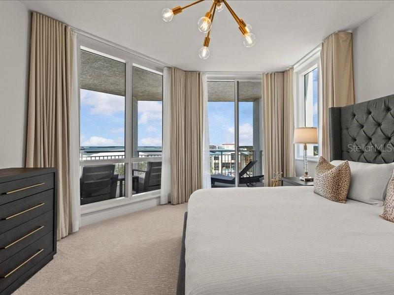 331 Cleveland Street, Unit 806 Clearwater, FL 33755 - Photo 43 of 83 a bedroom with a large bed and a large window