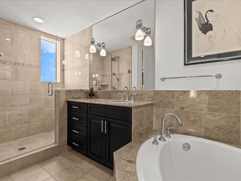 331 Cleveland Street, Unit 806 Clearwater, FL 33755 - Photo 45 of 83 a bathroom with a double vanity sink mirror and double