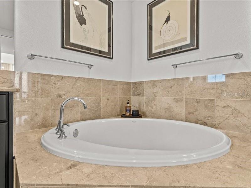 331 Cleveland Street, Unit 806 Clearwater, FL 33755 - Photo 46 of 83 a bathroom with a sink and a mirror