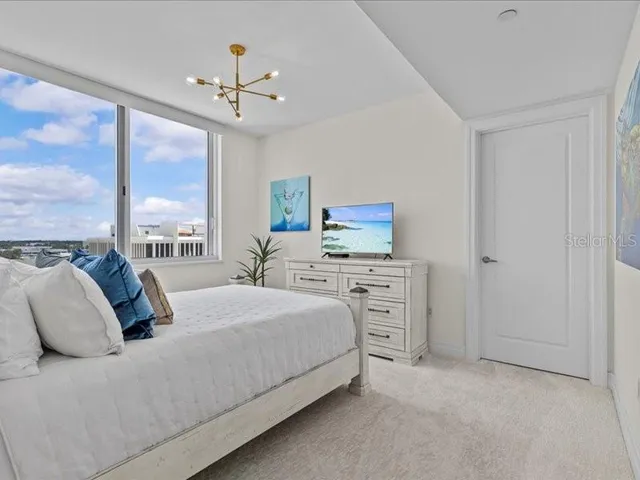 a kitchen with granite countertop a refrigerator and a sink