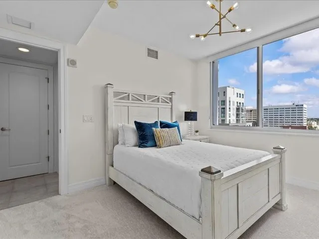 a kitchen with stainless steel appliances granite countertop a stove sink and cabinets
