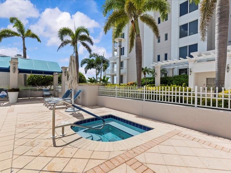 331 Cleveland Street, Unit 806 Clearwater, FL 33755 - Photo 59 of 83 a swimming pool with outdoor seating and yard