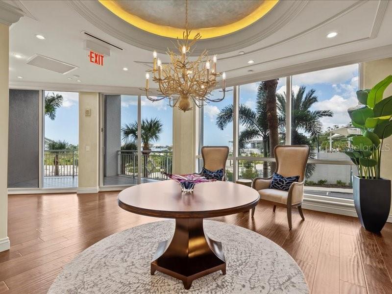 331 Cleveland Street, Unit 806 Clearwater, FL 33755 - Photo 71 of 83 a view of a dining room with furniture window and wooden floor
