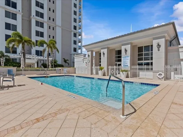 a bedroom with furniture and a chandelier