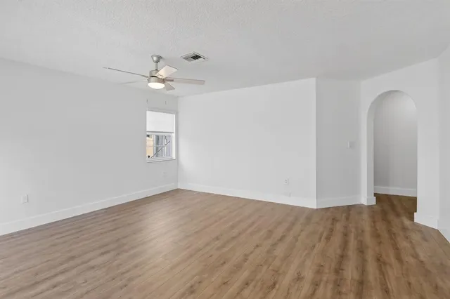 a view of kitchen with furniture and wooden floor