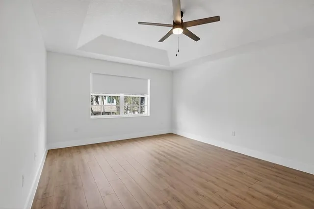 a view of kitchen and bathroom with wooden floor