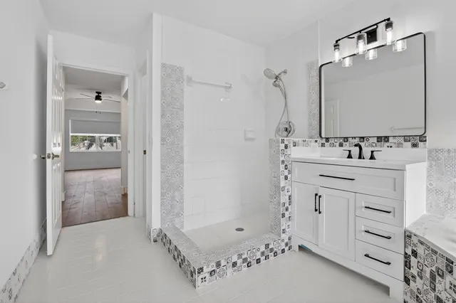 a view of a backyard with swimming pool